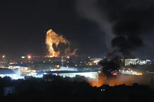 Smoke and fire rise from Israeli airstrikes in Dahiyeh, Beirut, Lebanon, Lebanon, Thursday, Nov. 7, 2024. (AP Photo/Hassan Ammar)
