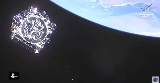 This photo provided by NASA, the James Webb Space Telescope is separated in space on Saturday, Dec. 25, 2021.  NASA's James Webb Space Telescope soared from French Guiana on South America’s northeastern coast, riding a European Ariane rocket into the Christmas morning sky.  The $10 billion infrared observatory is intended as the successor to the aging Hubble Space Telescope. (NASA via AP)