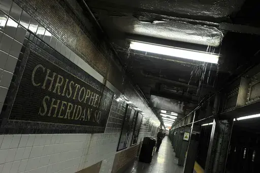 Rainwater seeps down into the Christopher Street-Sheridan Square subway station, March 30, 2010, in New York. The New York City subway station would be renamed to commemorate the Stonewall Inn protests that galvanized the modern LGBTQ rights movement, under legislation approved by state lawmakers as they wrapped up their session in June 2024. (AP Photo/Stephen Chernin, File)