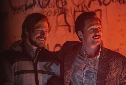 This image released by Apple TV+ shows Nikita Efremov, left, and Taron Egerton in a scene from "Tetris," premiering March 31, 2023. (Angus Pigott/Apple TV+ via AP)