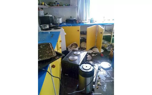 Debris lies strewn across the floor in the kitchen of Renagi Ravu's house in Kainantu, following a strong earthquake in northeastern Papua New Guinea, Sunday Sept. 11, 2022. The U.S. Geological Survey has detected a 7.6-magnitude earthquake in northeastern Papua New Guinea.  (Renagi Ravu via AP)