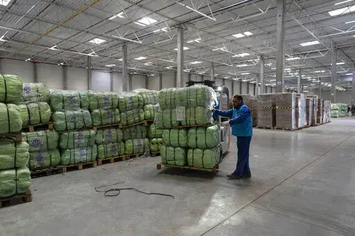 UNHCR staff load a truck with supplies for Ukraine in an aid warehouse at Rzeszow airport, in Rzeszow, southeastern Poland, Wednesday, March 16, 2022. As staggering as the immediate humanitarian need is for the more than 10 million displaced Ukrainians refugees, Open Society Foundations President Mark Malloch-Brown says their long-term needs will be even larger if they aren’t also addressed now. Experts say there has been an “unprecedented” outpouring of support for the humanitarian needs 