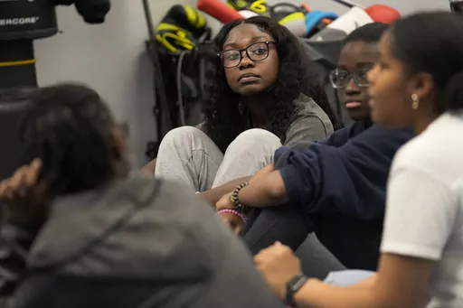 Hillary Amofa listens to others member of the Lincoln Park High School step team after school Friday, March 8, 2024, in Chicago. When she started writing her college essay, Amofa told the story she thought admissions offices wanted to hear. She wrote about being the daughter of immigrants from Ghana, about growing up in a small apartment in Chicago. She described hardship and struggle. Then she deleted it all. "I would just find myself kind of trauma-dumping," said the 18 year-old senior, "And I