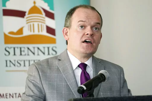 State Economist J. Cory Miller says employment in Mississippi decreased during the first months of the coronavirus pandemic in 2020, but personal income in the state increased during that time because of federal payments that were intended to head off a steep decline in the national economy, at the Stennis Capitol Press Forum in Jackson, Miss., Monday, Feb. 28, 2022. (AP Photo/Rogelio V. Solis)