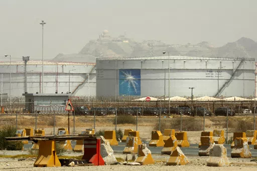 Storage tanks are seen at the North Jiddah bulk plant, an Aramco oil facility, in Jiddah, Saudi Arabia, on March 21, 2021. Saudi oil giant Aramco reported Sunday, March 10, 2024 a $121 billion profit last year, down from its 2022 record due to lower energy prices. (AP Photo/Amr Nabil, File)