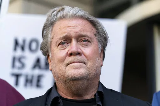 Former White House strategist Steve Bannon pauses as he departs federal court July 22, 2022, in Washington. Bannon, a longtime ally of former President Donald Trump, said Tuesday, Sept. 6, that he expects to be charged soon in a state criminal case in New York. Bannon, 68, plans to turn himself in on Thursday, according to a person familiar with the matter. The person insisted on anonymity to discuss an ongoing investigation. (AP Photo/Alex Brandon, File)