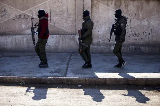 U.S. backed Syrian Democratic Forces soldiers search for Islamic State militants in Hassakeh, Syria,  Jan. 28, 2022.  The Pentagon says it killed a leader of the Islamic State in Syria in a drone strike. U.S. Central Command said in a news release that Maher al-Agal was killed Tuesday and an unidentified senior official in the Islamic State was seriously injured. (AP Photo/Baderkhan Ahma, File)
