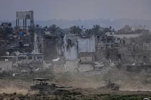 Israeli soldiers operate inside the Gaza Strip, as seen from southern Israel, on Feb. 13, 2024. The latest proposal for a cease-fire in Gaza has the support of the United States and most of the international community, but Hamas has not fully embraced it, and neither, it seems, has Israel.(AP Photo/Ariel Schalit, File)