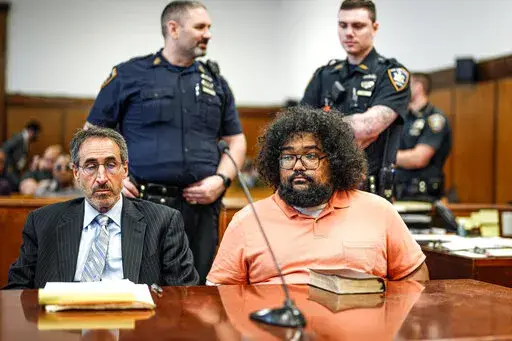 Richard Rojas, right, appears in court, with his attorney Enrico DeMarco, as he waits for the verdict in his trial, in New York, Wednesday, June 22, 2022. Rojas, who drove his car through crowds of people in Times Square in 2017, killing a young tourist and maiming helpless pedestrians, was cleared of responsibility because of mental illness. (Curtis Means/Daily Mail/Pool Photo via AP)