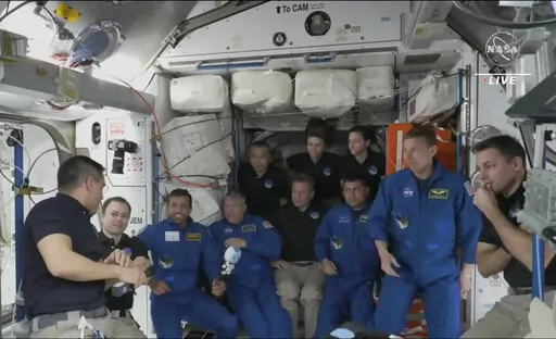 In this image from NASA TV, the four astronauts including United Arab Emirates' Sultan al-Neyadi, third left gather, during the welcoming ceremony, on the International Space Station, Friday, March 3, 2023. A new crew from the United States, Russia and United Arab Emirates has arrived at the International Space Station. The new arrivals include United Arab Emirates' Sultan al-Neyadi, the first astronaut from the Arab world who will spend an extended time in space. Al-Neyadi is only the second pe