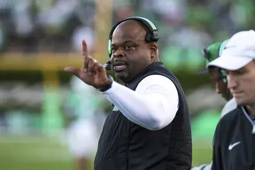Marshall head coach Charles Huff signals from the sideline during an NCAA college football game against Louisiana Monroe, Saturday, Nov. 2, 2024, in Huntington, W.Va. (Sholten Singer/The Herald-Dispatch via AP, File)