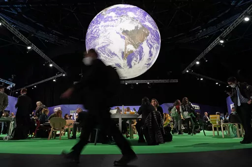 Delegates gather inside the venue on another day at the COP26 U.N. climate summit in Glasgow, Scotland, Wednesday, Nov. 3, 2021. A senior United Arab Emirates official says the Gulf nation wants the U.N. climate summit it's hosting later this year to deliver “game-changing results” for international efforts to curb global warming, but doing so will require having the fossil fuel industry at the table. (AP Photo/Alberto Pezzali, File)