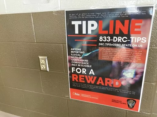 A poster created by the Ohio prisons system in partnership with the Ohio State Highway Patrol to promote a tip phone line and email address for an initiative dubbed “Know Something? Tell us,” that offers possible rewards for reports of contraband is shown March 28, 2022, in Columbus, Ohio. From X-ray body scanners to anti-drone technology, the state is ramping up efforts to keep contraband out of Ohio prisons as drugs and other illicit goods flood inside, even when visitation was curbed duri
