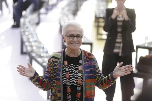 Rosita Missoni poses for photographers before the Missoni women's Spring/Summer 2018/19 fashion collection, presented in Milan, Italy, Sept. 23, 2017. (AP Photo/Luca Bruno, File)