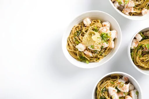 This image released by Milk Street shows a recipe for Ramen Salad with Shrimp and Scallions. (Milk Street via AP)