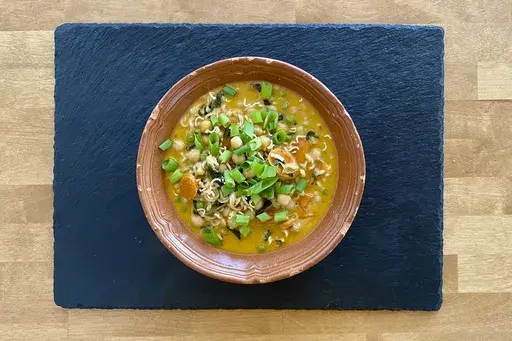 This image shows a recipe for khao soi Thai soup from “You Gotta Eat,” by Margaret Reby, in Barcelona, Spain on Dec. 16, 2024. (Albert Stumm via AP)