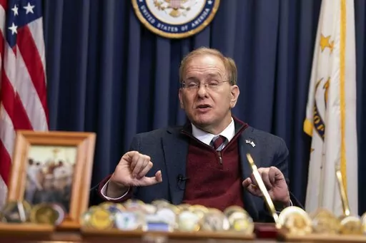Rep. Jim Langevin, D-R.I., speaks with a reporter in his office, Friday, March 25, 2022, in Warwick, R.I.  After the Capitol riot,  Langevin said he thought briefly that the foolishness and recklessness of dividing the country would finally stop. That didn’t happen, and the Rhode Island Democrat says it’s one reason why he’s leaving Congress.    (AP Photo/Michael Dwyer)