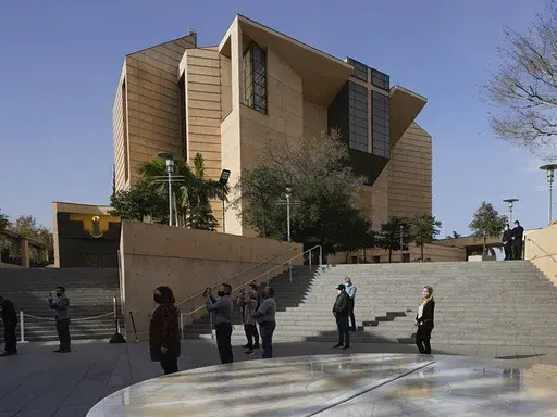 People attend a memorial service outside the Cathedral of Our Lady of Angels in Los Angeles, Jan. 19, 2021. (AP Photo/Damian Dovarganes,File)