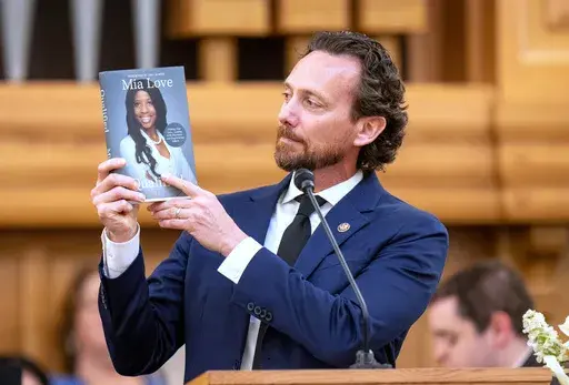 Husband Jason Love speaks at funeral services for former U.S. Rep. Mia Love at the University of Utah Institute of Religion in Salt Lake City on Monday, April 7, 2025. (Rick Egan/The Salt Lake Tribune via AP, Pool)