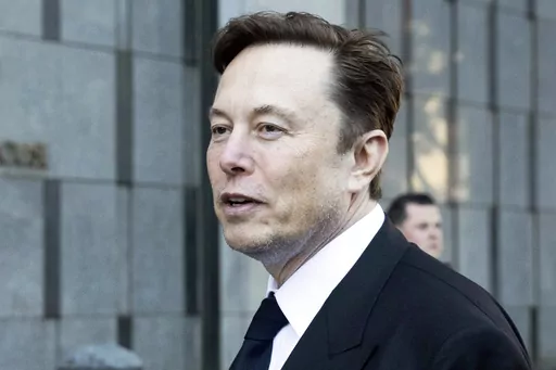 Elon Musk departs the Phillip Burton Federal Building and United States Court House in San Francisco on Jan. 24, 2023. Billionaire Elon Musk has told the BBC that running Twitter has been “quite painful” but that the social media company is now roughly breaking even after he acquired it late last year. (AP Photo/Benjamin Fanjoy, File)