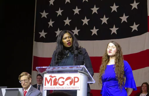 Kristina Karamo speaks to Michigan Republican Party delegates Saturday, Feb. 18, 2023, in Lansing, Mich. Karamo, who was overwhelmingly defeated in her bid to become Michigan’s secretary of state, was chosen Saturday to lead the state's Republican Party for the next two years. (AP Photo/Joey Cappelletti)