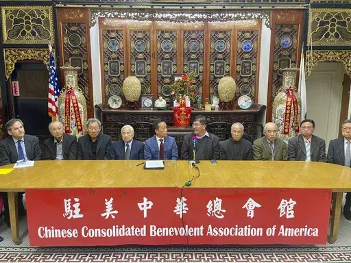 Members of the Chinese Consolidated Benevolent Association of America sit during a news conference in the Chinatown district of San Francisco on Friday, Jan. 24, 2025. (AP Photo/Haven Daley)