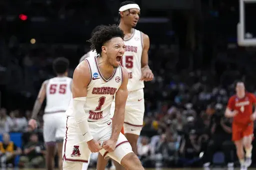 Alabama guard Mark Sears (1) celebrates after scoring during the first half of an Elite 8 college basketball game against Clemson in the NCAA tournament Saturday, March 30, 2024, in Los Angeles. (AP Photo/Ashley Landis, File)