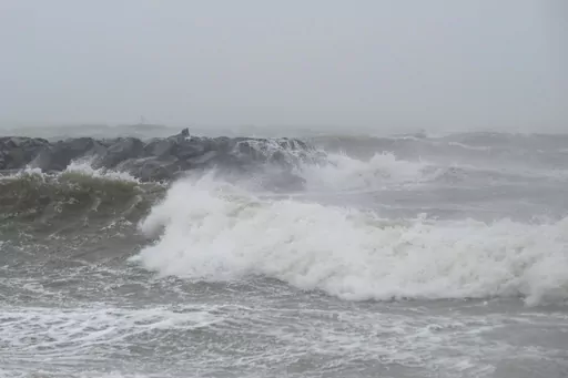 Waves crash at Outlook Beach in Hampton, Va., Sept. 30, 2022. Storms with strong gusting winds sometimes cause a phenomenon known as a meteotsunami, in which the winds push on the water and increase the wave height near the coast before it eventually crashes onto shore. (Billy Schuerman/The Virginian-Pilot via AP, File)