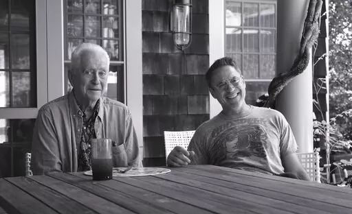 This image released by Netflix shows Robert Downey Sr., left, and his son Robert Downey Jr. from the documentary "Sr." (Netflix via AP)