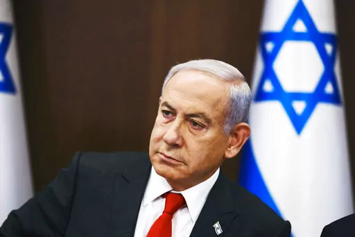 Israeli Prime Minister Benjamin Netanyahu convenes a weekly cabinet meeting at the Prime Minister's office in Jerusalem, Sunday, Jan. 8, 2023. (Ronen Zvulun/Pool Photo via AP)