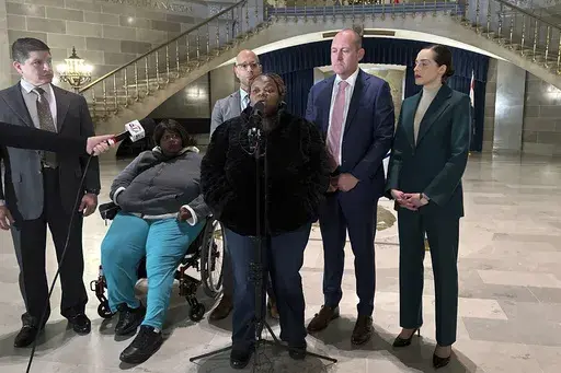 Oriel Moore describes her life without her brother, Othel Moore Jr., to reporters Dec. 19, 2023, at the Missouri Capitol in Jefferson City, Mo. (AP Photo/Summer Ballentine, File)