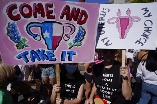 FILE —Demonstrators rally to to demand continued access to abortion during the March for Reproductive Justice, Oct. 2, 2021, in downtown Los Angeles.   State-by-state battles over the future of abortion in the U.S. are setting up across the country as lawmakers in Republican-led states propose new restrictions modeled on laws passed in Texas and Mississippi even as some Democratic-controlled states work to preserve access.   (AP Photo/Damian Dovarganes, file)
