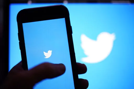 The Twitter application is seen on a digital device, Monday, April 25, 2022, in San Diego. A toxic cesspool. A lifeline. A finger on the world's pulse. Twitter is all these things and more to its over 217 million users around the world — politicians, journalists, activists, celebrities, weirdos and normies, cat and dog lovers and just about anyone else with an internet connection.  (AP Photo/Gregory Bull)