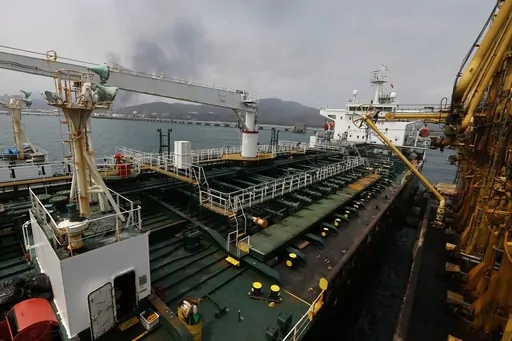 Iranian oil tanker Fortune is anchored at the dock of the El Palito refinery near Puerto Cabello, Venezuela, May 25, 2020. A dozen senators are making a bipartisan appeal to President Joe Biden to reinvigorate the power of U.S. authorities to seize Iranian oil assets under an enforcement program they say has been allowed to languish. Despite existing sanctions, Iranian oil exports jumped 35% last year and proceeds are being used to sponsor attacks on U.S. citizens and servicemembers as well as a
