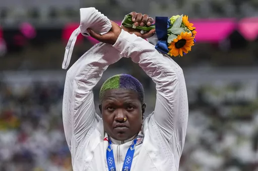 Raven Saunders, of the United States, poses with her silver medal in women's shot put at the 2020 Summer Olympics, Sunday, Aug. 1, 2021, in Tokyo, Japan. Saunders, the silver-medal shot putter who used her platform at the Tokyo Olympics to bring attention to social injustice, has been suspended for 18 months for failing to show up for doping tests. The U.S. Anti-Doping Agency announced the sanction Wednesday, March 15, 2023, for the 26-year-old, saying she had committed three “whereabouts fail