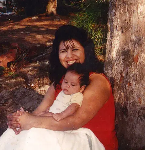 In this undated photograph, Texas death row inmate Melissa Lucio is holding one of her sons, John. Lucio is set to be executed on April 27 for the 2007 death of her 2-year-old daughter Mariah. Prosecutors say Lucio fatally beat Mariah but Lucio has long denied that, saying her daughter died from injuries sustained during a fall down a flight of stairs. Her lawyers say Lucio's history of sexual and physical abuse led to her giving an unreliable confession. They hope to persuade the state's Board 