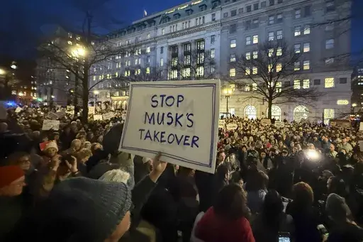 People protest during a rally outside the Treasury Department in Washington, Feb. 4, 2025. (AP Photo/Jose Luis Magana, File)
