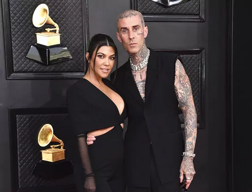 Kourtney Kardashian, left, and Travis Barker appear at the 64th Annual Grammy Awards in Las Vegas on April 3, 2022. TMZ was first to report Tuesday that the two married at a Las Vegas chapel just hours after attending the Grammys but Kardashian confirmed on social media on April 6, that no marriage license was issued. (Photo by Jordan Strauss/Invision/AP, File)