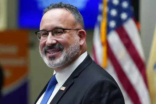 Secretary of Education Miguel Cardona speaks during a visit with first lady Jill Biden to Bergen Community College in Paramus, N.J., Jan. 20, 2022. The Biden administration plans to freeze federal student loan payments through Aug. 31, extending a moratorium that has allowed millions of Americans to postpone payments during the coronavirus pandemic. The decision was confirmed by an administration official familiar with the White House’s decision-making. (AP Photo/Seth Wenig, File)