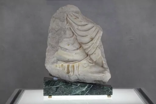 A Parthenon fragment, on loan from the Antonino Salinas Regional Archaeological Museum of Palermo, at the Acropolis Museum, in Athens, on Monday, Jan. 10, 2022. The 2,500-year-old fragment is formally on loan from Sicily's A. Salinas Archaeological Museum, but both sides have said it could well end up permanently in Athens. Greek officials hope the move could encourage the British Museum to return its own extensive collection of sculptures from the Parthenon Temple on the Acropolis – a decades