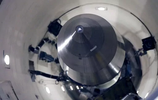 An inert Minuteman III missile is seen in a training launch tube at Minot Air Force Base, N.D., June 25, 2014. Nine military officers who had worked decades ago at a nuclear missile base in Montana, home to a vast field of 150 Minuteman III intercontinental ballistic missile silos, have been diagnosed with blood cancer and there are “indications” the disease may be linked to their service, according to military briefing slides obtained by The Associated Press. One of the officers has died. (