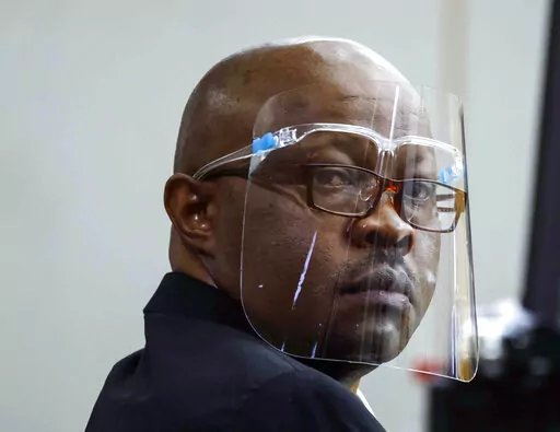 Accused serial killer Billy Chemirmir looks back during his retrial on April 25, 2022, at Frank Crowley Courts Building in Dallas. A man who has been charged with killing 22 women in the Dallas area is set to go on trial in the death of an 87-year-old woman. Billy Chemirmir's capital murder trial in the death of Mary Brooks is scheduled to begin Monday, Oct. 3, 2022, in Dallas. (Shafkat Anowar/The Dallas Morning News via AP, Pool, File)