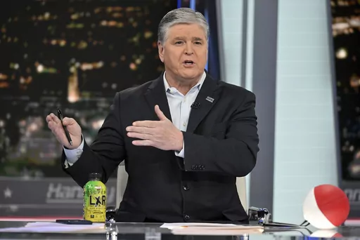 FILE- Fox News commentator Sean Hannity speaks during an interview at Fox News Studios, March 16, 2023, in New York. Tucker Carlson, Hannity and Bret Baier are among the stars that both Fox News and the voting machine company suing it for defamation have signaled could testify if the explosive case heads to trial next month.(Photo by Evan Agostini/Invision/AP)