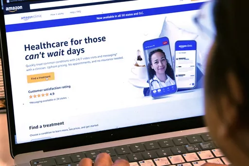 A page from Amazon's clinic site is shown on a laptop in New York on Tuesday, Aug. 1, 2023. Amazon is adding video telemedicine visits in all 50 states to the virtual clinic it launched last fall, as the e-commerce giant pushes deeper into care delivery. (AP Photo/Peter Morgan)