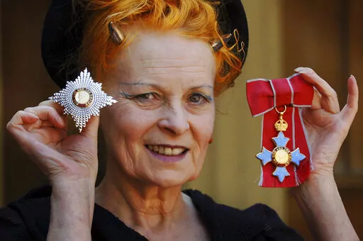 Dame Vivienne Westwood poses for a photo after collecting her insignia from Britain's Prince Charles during an Investiture ceremony at Buckingham Palace, London on June. 9, 2006. Westwood, an influential fashion maverick who played a key role in the punk movement, died Thursday, Dec. 29, 2022, at 81. (Fiona Hanson, Pool via AP, File)