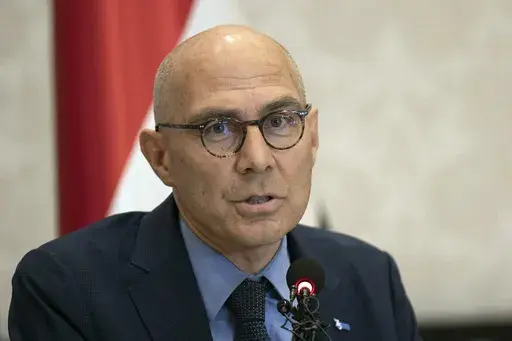 U.N. High Commissioner for Human Rights Volker Turk, speaks during a news conference in Baghdad, Iraq, Aug. 9, 2023. The United Nations is calling for "a clear, transparent and credible investigation" of mass graves uncovered at two major hospitals in war-torn Gaza that were raided by Israeli troops. (AP Photo/Hadi Mizban, File)