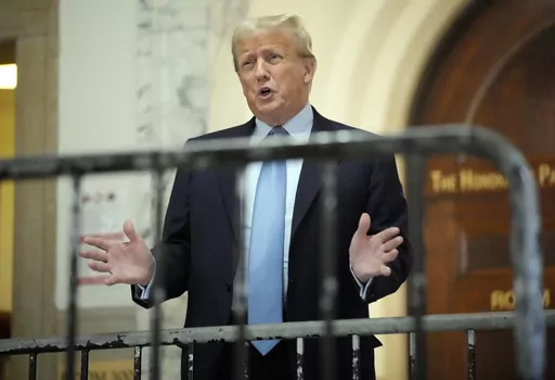 Former President Donald Trump speaks as he returns to the courtroom after the lunch break of his civil business fraud trial, Wednesday, Oct. 18, 2023, at New York Supreme Court in New York. (AP Photo/Seth Wenig)