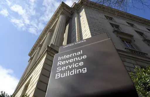 The exterior of the Internal Revenue Service (IRS) building in Washington, on March 22, 2013. One of Washington's favorite punching bags, the Internal Revenue Service, may finally get the resources it's been asking Congress for if Democrats get their economic package focused on energy and health care over the finish line. (AP Photo/Susan Walsh, File)