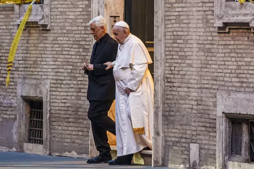 Pope Francis is flanked by Jesuits' superior general Arturo Sosa Abascal, left, after presiding a mass on March 12, 2022. Pope Francis’ Jesuit religious order said Thursday, June 15, 2023 it has expelled a prominent Slovenian priest from the congregation following allegations of sexual, spiritual and psychological abuses against adult women. (AP Photo/Domenico Stinellis, File)