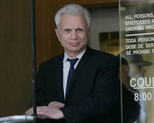 Actor Robert Blake leaves court for the lunch break, Oct. 3, 2005, after his second day of testimony in a wrongful death lawsuit, brought by the family of Bonny Lee Bakley, in Burbank, Calif. Blake, the Emmy award-winning performer who went from acclaim for his acting to notoriety when he was tried and acquitted of murdering his wife, died Thursday, March 9, 2023, at age 89. (AP Photo/Nick Ut, File)
